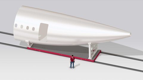 3D-Rendering eines Flugzeugrumpfes das auf erner waverail Schienenanlage transprtiert wird.