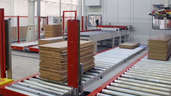Roller Conveyor with stacked boxes for efficient material handling in a warehouse environment 