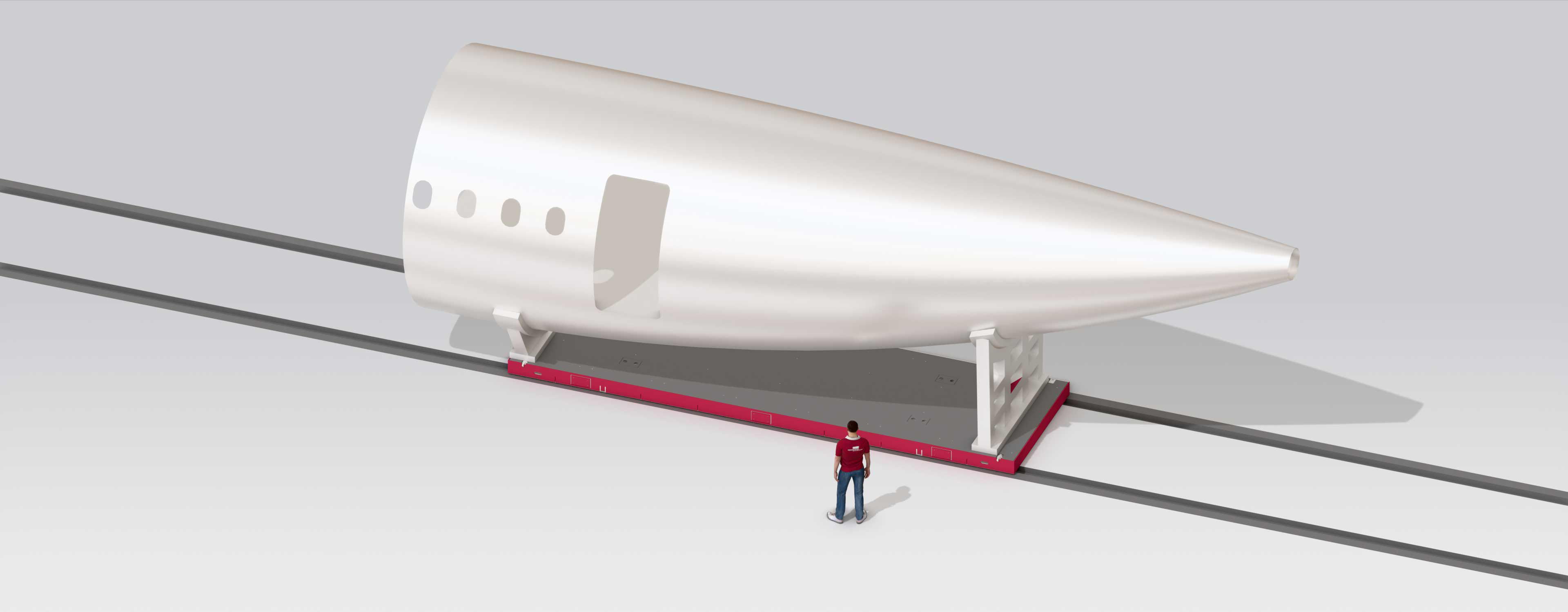 3D rendering of an aircraft fuselage being transported on a waverail track.